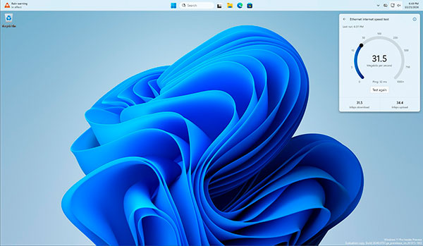 Test de velocidad de Internet de Windows 11 mostrando descarga, subida y ping en los ajustes rápidos